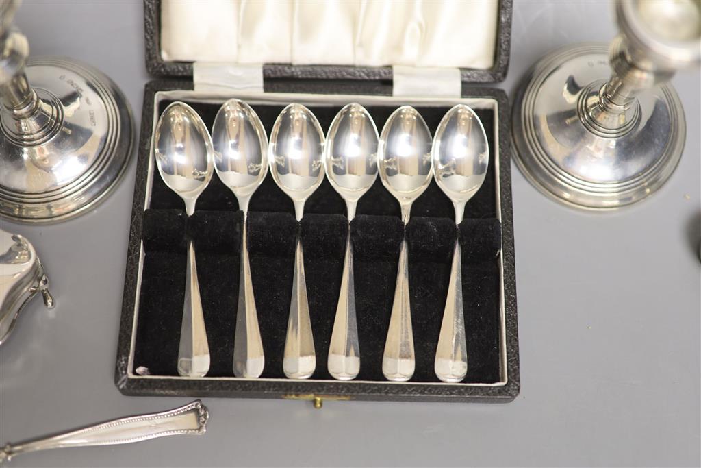 A pair of modern silver dwarf candlesticks, London, 1977, 10.6cm, weighted, two silver condiments, etc.